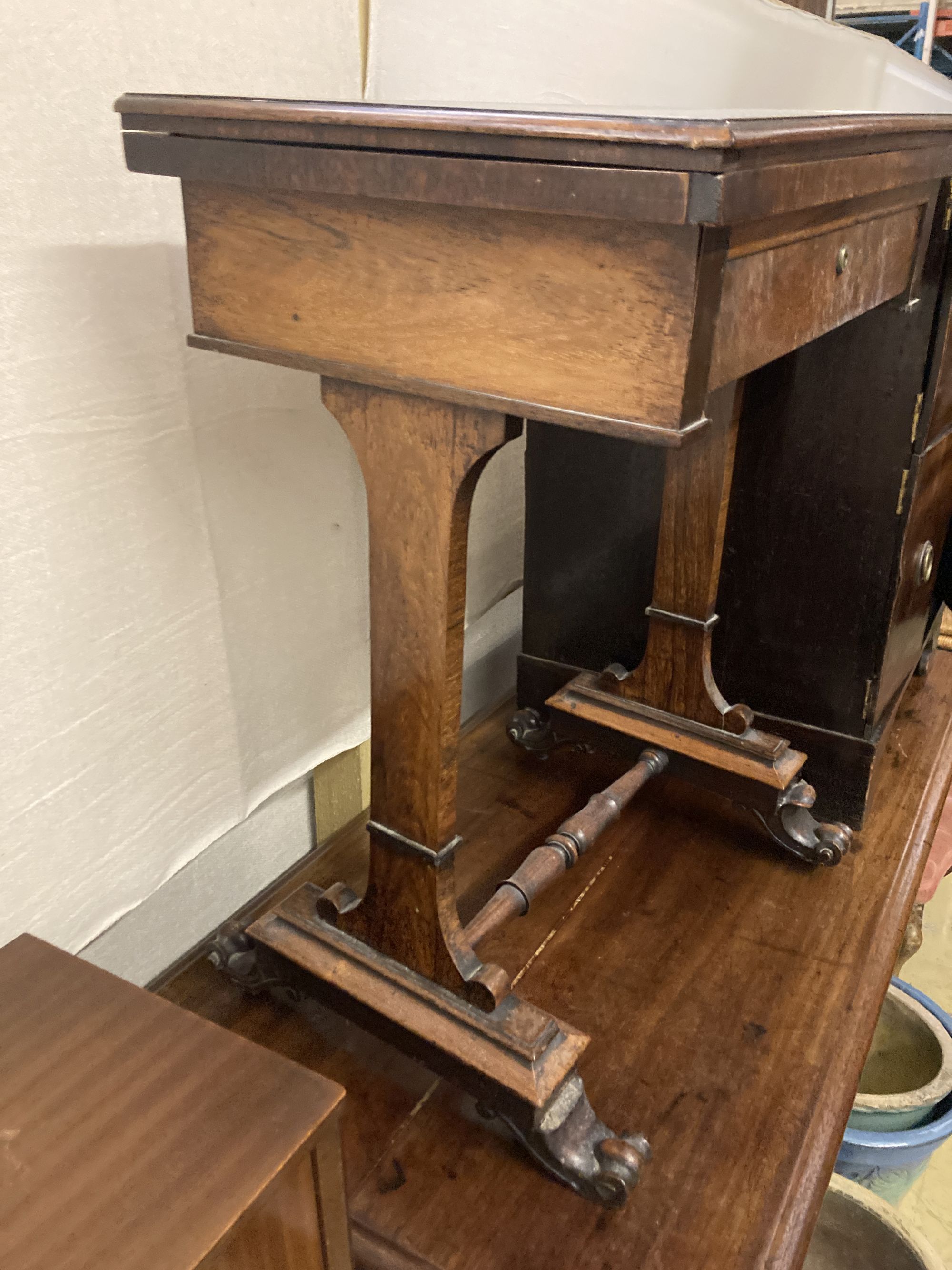 A Victorian rosewood work table, with a folding top, width 54cm depth 38cm height 71cm